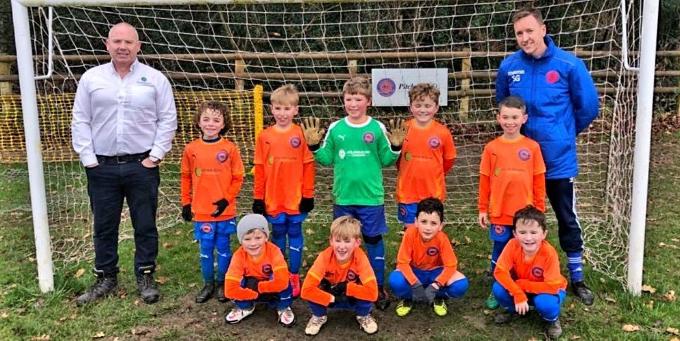 Caterham football team sponsored by Nolan Building consultancy in Caterham